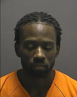 Maxwell Ledell Padmore, Columbia resident and now convicted felon, seen in police photograph, was found guilty on 32 counts in Howard County.