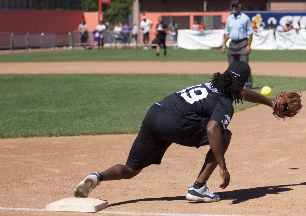 a member of the Ravens defense in the midst of play at the Lardarius Webb Charity Softball Game.