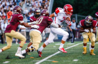 Hammond defender Francis Afoakwah zeroes in on Centennial ball carrier Michael Klein for a tackle in the first half of the 2016 season opening game at Golden Bear Stadium. The Centennial Eagles defeated Hammond 30-21 Friday night. Photo by YANAIR PHOTOGRAPHY