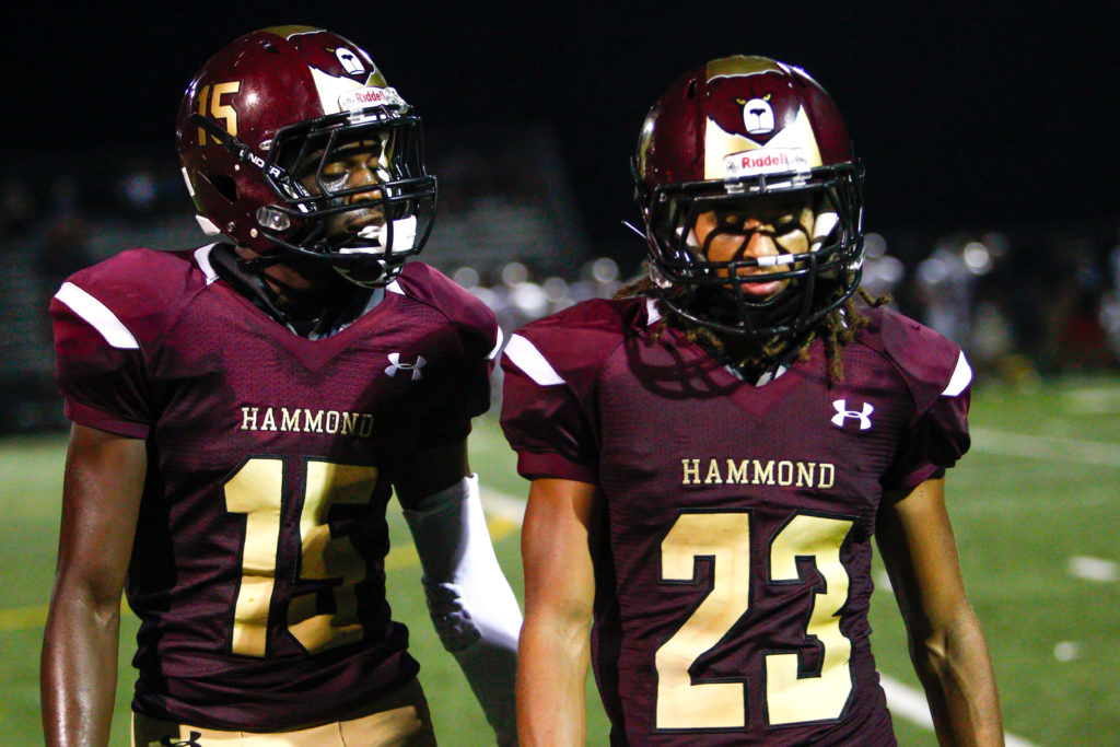 Hammond Golden Bear football players Kirkland Wise (left) and Paskel Cheeves head toward the HHS sideline in the third quarter of Glenelg's 44-0 victory at Golden Bear Stadium Friday evening. Wise caught two passes for 45 yards. Cheeves intercepted a Glenelg pass in the second quarter. Photo by YANAIR PHOTOGRAPHY.