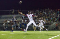 Hammond receiver Rocklin Curtis (#7) reaches for a third quarter pass attempt from quarterback Elijah Lindsey at Marriotts Ridge High School Friday evening. Curtis hauled down passes of 32 and 27 yards in Hammond's 28-0 loss to MRHS. HHS receiver Kirkland Wise (#15) watches the play.