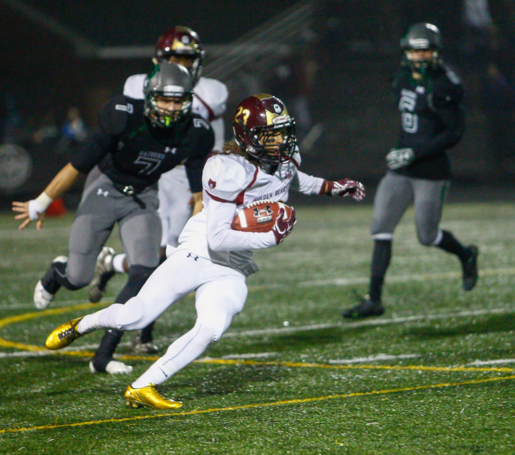 Hammond High School running back Paskel Cheeves cuts back on Atholton High School stadium’s all-weather turf during a first quarter run. Cheeves scored Hammond’s lone touchdown Friday evening. Atholton won 51-6. Photo by YANAIR PHOTOGRAPHY.