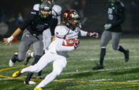 Hammond High School running back Paskel Cheeves cuts back on Atholton High School stadium’s all-weather turf during a first quarter run. Cheeves scored Hammond’s lone touchdown Friday evening. Atholton won 51-6.  Photo by YANAIR PHOTOGRAPHY.