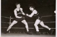 Maryland Boxing vs. West Point.jpg -- A University of Maryland boxer goes head-to-head against a boxer from Army in 1937. University of Maryland's boxing team existed from 1930 until the university shut it down in 1955. Special Collections and University Archives, University of Maryland Libraries. Copyright 1937 University of Maryland. (Special Collections and University Archives, University of Maryland Libraries. Copyright 1938 University of Maryland.)