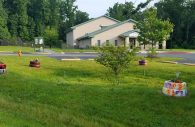 The grounds of Ridgely’s Run Community Center at 8400 Mission Road in Jessup, Maryland were decorated this spring by recycling illegally dumped tires and repurposing them as planters. The effort to keep the area free of debris continues. (Photo by Ricardo Whitaker)