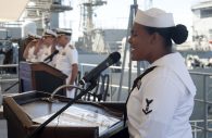 PEARL HARBOR - (Sept. 21, 2018) - Boatswain’s Mate 3rd Class Edith Lemus, assigned to the submarine tender USS Emory S. Land (AS 39), sings the national anthem during a change of command ceremony, in which Capt. Michael Luckett relieved Capt. Douglas A. Bradley as commanding officer, in Pearl Harbor, Sept. 21. Land is currently deployed as an expeditionary submarine tender on an extended deployment conducting coordinated tended moorings and afloat maintenance in the U.S. 5th and 7th Fleet areas of operations. Land and USS Frank Cable (AS 40), the U.S. Navy’s only two submarine tenders, both homeported in Apra Harbor, Guam, provide maintenance, hotel services and logistical support to submarines and surface ships in the U.S. 5th and 7th Fleet areas of operation. (U.S. Navy photo by Mass Communication Specialist 2nd Class Daniel Willoughby/RELEASED)