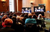 WASHINGTON - Members of the public sat silently watching television Thursday in an overflow room near the Senate Judiciary Committee hearing where Christine Blasey Ford detailed her sexual assault charges against Supreme Court nominee Brett Kavanaugh. (Albane Guichard/Capital News Service)