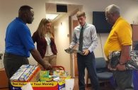 From left to right, Anthony Butler, Co-Advisor of the NAACP Youth Council, Trish Lannon, Assistant Principal at Guilford Elementary School, Jonathan Davis, Principal of Guilford Elementary School, and Paul Wharton, Youth Advisor of NAACP Youth Council chatting about logistics of food deliveries meant for underprivileged children in the GES area.