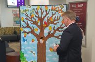 Howard County Executive Alan Kittleman standing beside the Remembrance Tree after briefly addressing the a crowd at the Howard County Health Department.