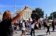 WASHINGTON - Protesters march to the Supreme Court to rally against the confirmation of Brett Kavanaugh to the nation's highest court. (Albane Guichard/Capital News Service)