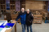 ELLICOTT CITY, Maryland — Len Berkowitz, 74, and wife Sherry Fackler-Berkowitz, 65, stand in now-gutted Great Panes Art Glass Studio on Ellicott City's Main Street. The shop sits over the Tiber Branch, which flooded earlier in 2018, inundating the shop. (Chris Cioffi/Capital News Service)