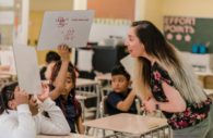 Vanessa Gonzalez ’19 teaches a math lesson with Lakeland Elementary School students. Photo by Marlayna Demond ’11 for UMBC.