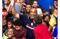 Former wide-receiver for the Philadelphia Eagles, Ray Sydnor, surrounded by children is set to co-host this year's Youth Basketball and Life Skills Clinic in Columbia, Maryland